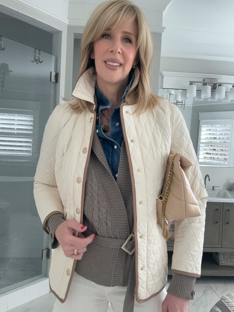 woman wearing winter white with denim and a cardigan showing classic style at any age